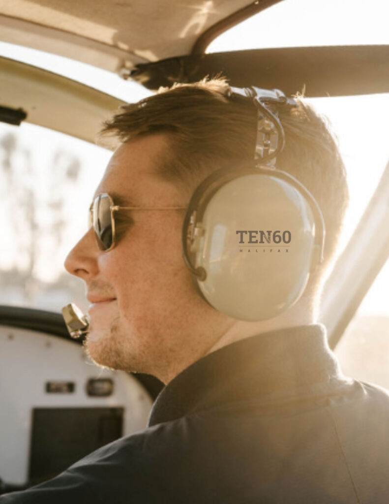 Man in plane cockpit with headset