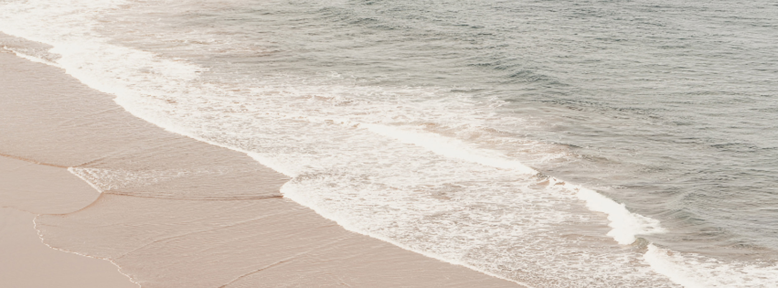 Ocean tide on sandy beach