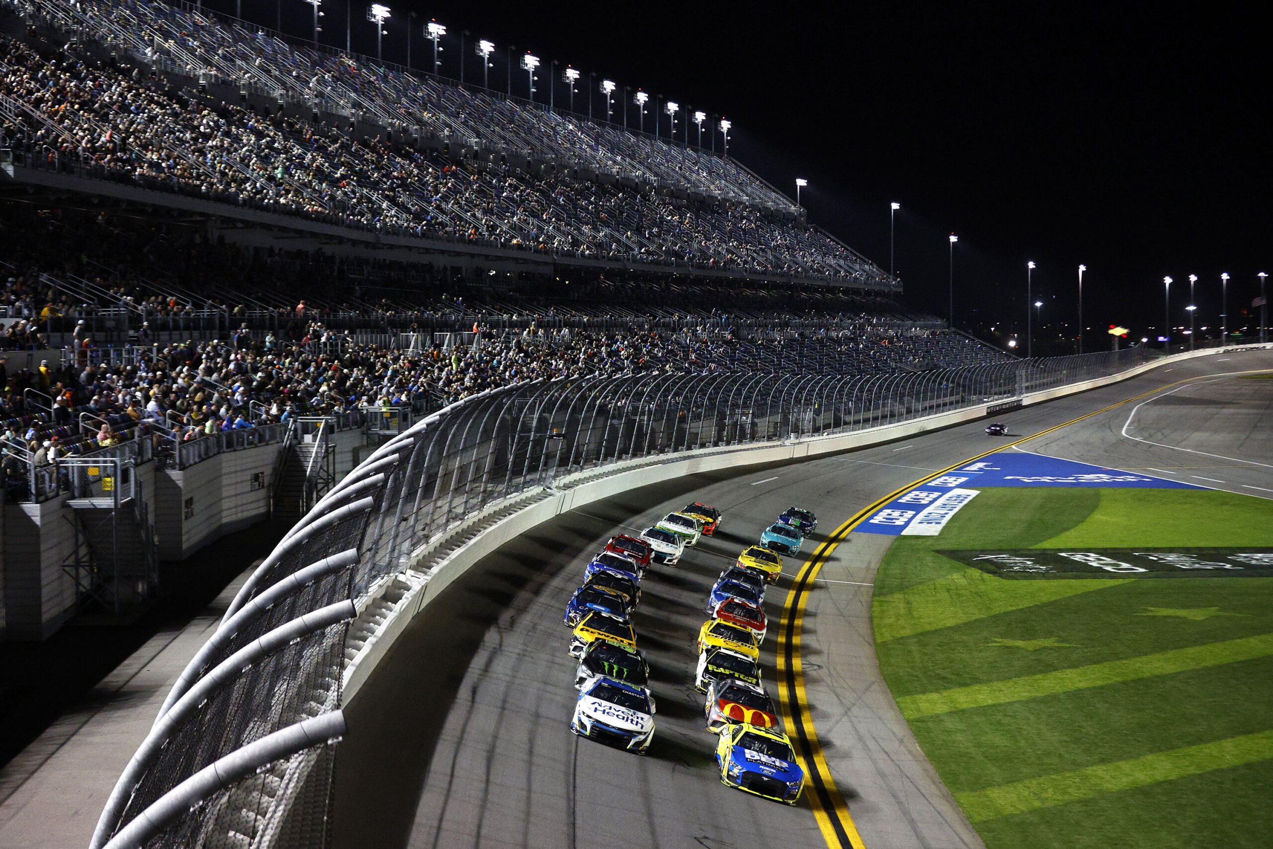 Aerial view of cars racing on the Daytona International Speedway